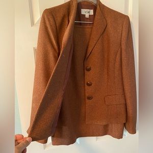 Beautiful tweed suit. Skirt is fitted